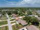 An aerial view of a home nestled within a quiet residential neighborhood at 1867 Neptune Dr, Englewood, FL 34223
