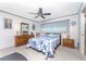 Bedroom with floral bedding and wood furniture at 1867 Neptune Dr, Englewood, FL 34223