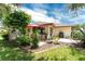 Spacious backyard with patio, grill, and mature landscaping at 1867 Neptune Dr, Englewood, FL 34223