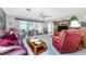 Relaxing living room with a view of the backyard and comfortable seating at 1867 Neptune Dr, Englewood, FL 34223