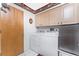 Laundry room with washer, dryer, and cabinets at 1867 Neptune Dr, Englewood, FL 34223