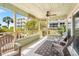 Screened porch with seating and tropical views at 2350 N Beach Rd # 2A, Englewood, FL 34223