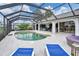 Large screened pool and patio with plenty of seating at 38 Bunker Way, Rotonda West, FL 33947