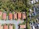 An aerial view shows a tree lined neighborhood with manicured lawns at 1012 Bradberry Dr, Nokomis, FL 34275