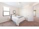 Bedroom with ceiling fan, window, closet, and a bed with a gray throw blanket at 1012 Bradberry Dr, Nokomis, FL 34275