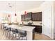 Spacious kitchen with a center island with bar stool seating and stainless steel appliances at 1012 Bradberry Dr, Nokomis, FL 34275