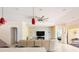 Well-lit living room that offers stairs to the second floor and an open doorway to an adjacent room at 1012 Bradberry Dr, Nokomis, FL 34275