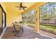 Enclosed patio shows screened windows with brick flooring and a table with seating creating a relaxing outdoor space at 1012 Bradberry Dr, Nokomis, FL 34275