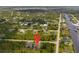 Aerial view of property and surrounding neighborhood with canal access at 14089 Newson Ln, Port Charlotte, FL 33981