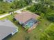 Aerial view showing house, pool, and surrounding neighborhood at 14089 Newson Ln, Port Charlotte, FL 33981