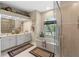 Elegant bathroom with double vanity, garden tub, and separate shower at 14089 Newson Ln, Port Charlotte, FL 33981