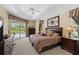 Spacious main bedroom with pool view, king-size bed and ample closet space at 14089 Newson Ln, Port Charlotte, FL 33981