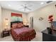 Spacious bedroom with king-size bed and en-suite bathroom access at 14089 Newson Ln, Port Charlotte, FL 33981