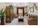 Comfortable Gathering room featuring a cozy sofa and large armoire at 14089 Newson Ln, Port Charlotte, FL 33981