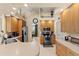 Kitchen with wood cabinets, stainless steel appliances, and breakfast bar at 14089 Newson Ln, Port Charlotte, FL 33981