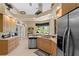Kitchen with stainless steel appliances and an island with a sink at 14089 Newson Ln, Port Charlotte, FL 33981