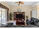 Living room with sectional sofa and entertainment center at 14089 Newson Ln, Port Charlotte, FL 33981