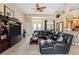 Open living area with sectional sofa, large TV, and hardwood floors at 14089 Newson Ln, Port Charlotte, FL 33981
