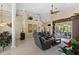 Spacious living room with a sectional sofa and access to a patio at 14089 Newson Ln, Port Charlotte, FL 33981