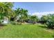 Lush backyard featuring a private boat dock and canal access at 200 Capstan Dr, Placida, FL 33946