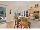Bright kitchen featuring a granite island, barstool seating and stainless steel appliances at 200 Capstan Dr, Placida, FL 33946