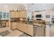 Kitchen featuring granite countertops, stainless steel appliances, and breakfast bar area at 200 Capstan Dr, Placida, FL 33946