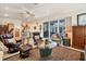 Inviting living room with cozy seating, area rug, and access to the backyard at 200 Capstan Dr, Placida, FL 33946