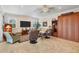 Spacious living room featuring tile floors, large windows, and neutral décor at 200 Capstan Dr, Placida, FL 33946