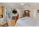 Bright main bedroom with walkout to patio, ensuite bathroom, and dresser at 200 Capstan Dr, Placida, FL 33946