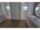 Bright bathroom with double sink vanity and two stand-up showers at 261 Broadmoor Ln, Rotonda West, FL 33947