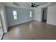 Spacious bedroom offers a stylish accent wall, recessed lighting and ceramic tile flooring at 261 Broadmoor Ln, Rotonda West, FL 33947