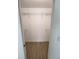 Walk-in closet with wire shelving and wood-look tile floor at 261 Broadmoor Ln, Rotonda West, FL 33947