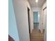 Hallway with ceramic tile flooring and views of other rooms at 261 Broadmoor Ln, Rotonda West, FL 33947