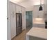 Kitchen boasts stainless steel appliances, white cabinetry and access to the laundry room at 261 Broadmoor Ln, Rotonda West, FL 33947