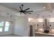 Bright, modern kitchen with stainless steel appliances, center island, and open layout at 261 Broadmoor Ln, Rotonda West, FL 33947