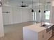 Open-concept living area with modern design elements, wood floors, and abundant natural light at 261 Broadmoor Ln, Rotonda West, FL 33947