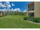 Condo building showcasing the screened-in patio areas at 6 Quails Run Blvd # 7, Englewood, FL 34223
