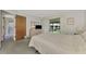 Bright bedroom with a double bed and access to a private balcony at 6 Quails Run Blvd # 7, Englewood, FL 34223