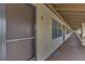 Building hallway with doors to individual units at 6 Quails Run Blvd # 7, Englewood, FL 34223