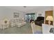 Comfortable living room with sofa, armchair, and coffee table at 6 Quails Run Blvd # 7, Englewood, FL 34223