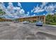 Two-story condo building with parking and balconies at 6 Quails Run Blvd # 7, Englewood, FL 34223