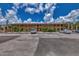 Two-story condo building with parking and balconies at 6 Quails Run Blvd # 7, Englewood, FL 34223