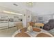 Kitchen with white appliances and a breakfast nook at 6 Quails Run Blvd # 7, Englewood, FL 34223