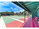 Community shuffleboard courts with covered seating at 6 Quails Run Blvd # 7, Englewood, FL 34223