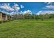 Spacious grassy backyard, great for outdoor activities at 6 Quails Run Blvd # 7, Englewood, FL 34223