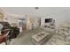 Spacious living room featuring comfortable seating, a TV, and a cozy atmosphere at 6 Quails Run Blvd # 7, Englewood, FL 34223