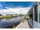 Relaxing deck with canal views and potted plants at 624 Blackburn Blvd, North Port, FL 34287