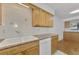 Kitchen features granite countertops and wood cabinets at 53 W Bay Heights Rd # 205, Englewood, FL 34223