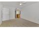 Bedroom with carpet, ceiling fan and en-suite bathroom at 53 W Bay Heights Rd # 205, Englewood, FL 34223