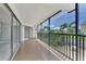 Screened balcony with view of the backyard at 53 W Bay Heights Rd # 205, Englewood, FL 34223